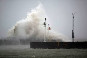 wave crashing against pier