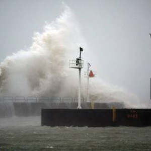 wave crashing against pier