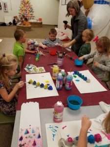 Kids in a class making craft