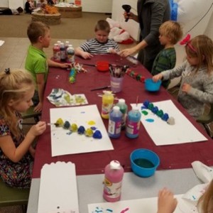 Kids in a class making craft