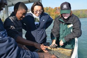 Kids learning about the great lakes on the river