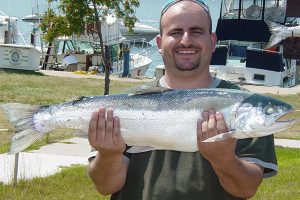 Showing off catch from charter fishing