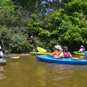 Paddlers learn about aquatic invasive species while out on the water