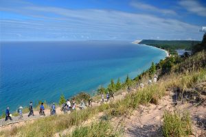 Sleeping Bear National Lakeshore hike along dune with Lake Michigan in background