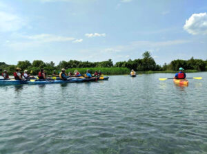 MI Paddle Stewards event, kayaks on the lake