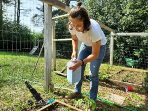 student working on project in garden