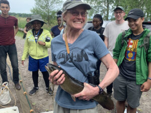 Catherine Riseng with Bowfin fish