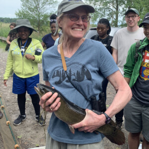 Catherine Riseng with Bowfin fish