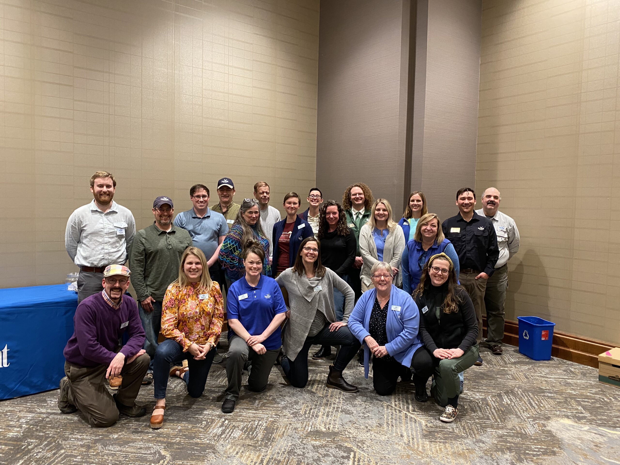 The whole Michigan Sea Grant staff poses for a photo in a hotel conference room