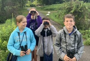 group of attendees with binoculars