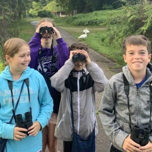 group of attendees with binoculars