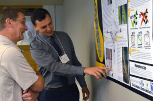 Tom at a student internship poster presentation