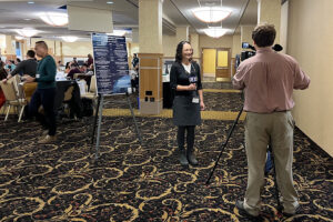 Val being interviewed by TV6 in the symposium space