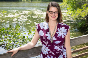 portrait of Silvia Newell with a river in the background.