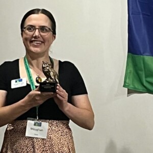 Meaghan Gass holds her award in the form of an owl, from MSTA.