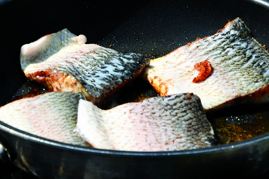 Fish frying in a pan
