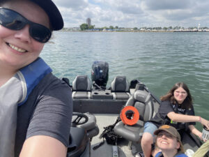 Researchers on a boat take sample in Lake St. Clair