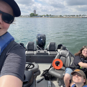 Researchers on a boat take sample in Lake St. Clair