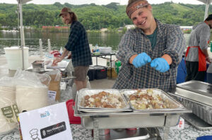 Peterson's Fish Market prepares a whitefish disk for participants