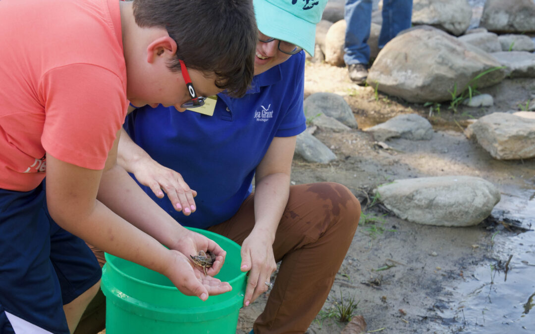 Hundreds celebrate native lake sturgeon at 2025 riverside release events