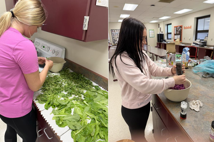 Two students sort through their aquaculture project