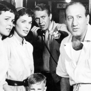 A group of four people from a black and white classic movie looking concerned