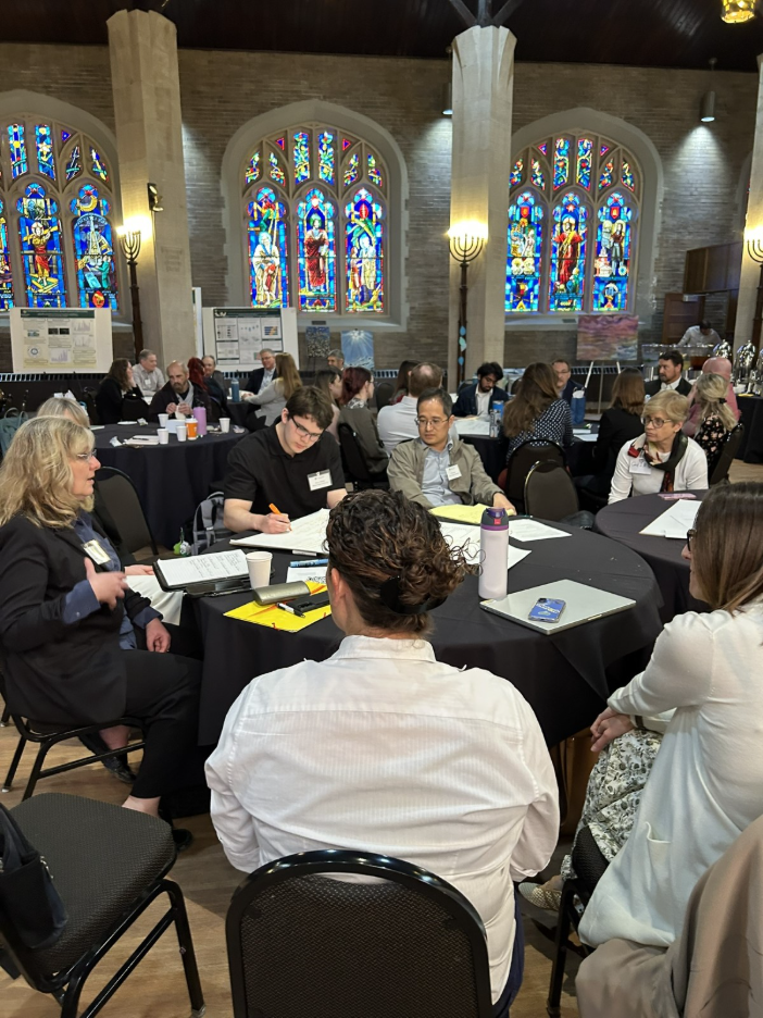participants at the May 12th conference collaborating in breakout groups, discussing emerging threats to our waters.